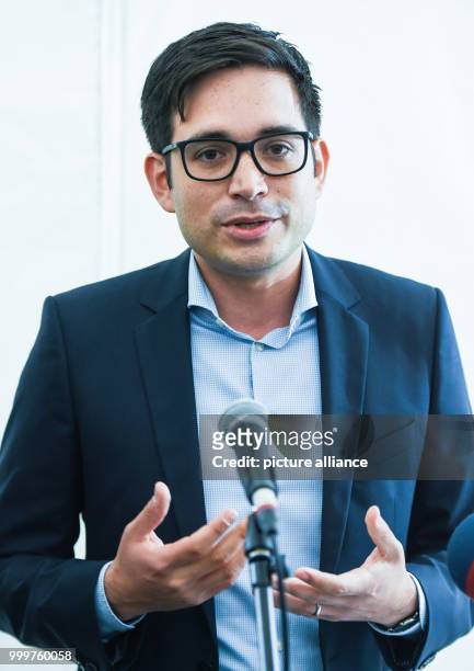 Bruno Ginnuth, chairman and co-founder of the ridesharing provider Clever Shuttle, powered by hydrogen, speaks at the main rail station in Hamburg,...