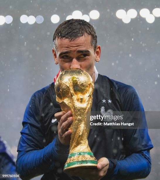 Antoine Griezmann of France celebrates with the World Cup Trophy following his sides victory in the 2018 FIFA World Cup Final between France and...