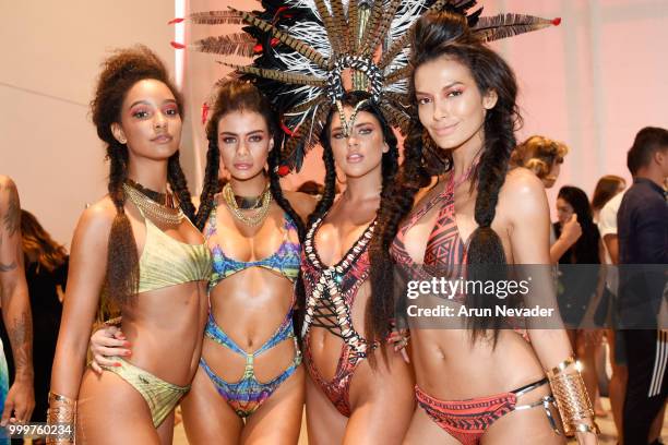 Models pose backstage at Miami Swim Week powered by Art Hearts Fashion Swim/Resort 2018/19 at Faena Forum on July 15, 2018 in Miami Beach, Florida.