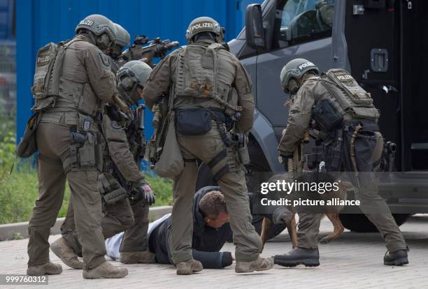 Members if the special elite commando SEK of the police simulate a terrorist attack in Frankfurt am Main, Germany, 8 September 2017. The dog...