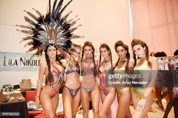 Models pose backstage at Miami Swim Week powered by Art Hearts Fashion Swim/Resort 2018/19 at Faena Forum on July 15, 2018 in Miami Beach, Florida.