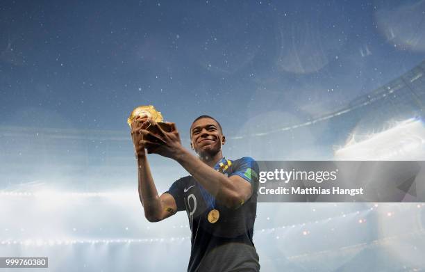 Kylian Mbappe of France celebrates with the World Cup Trophy following his sides victory in the 2018 FIFA World Cup Final between France and Croatia...