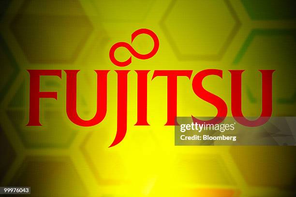 The Fujitsu logo is displayed on a screen during the opening of Fujitsu Laboratories Singapore in Biopolis, Singapore, on Wednesday, May 19, 2010....
