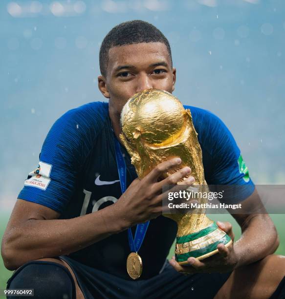 Kylian Mbappe of France celebrates with the World Cup Trophy following his sides victory in the 2018 FIFA World Cup Final between France and Croatia...