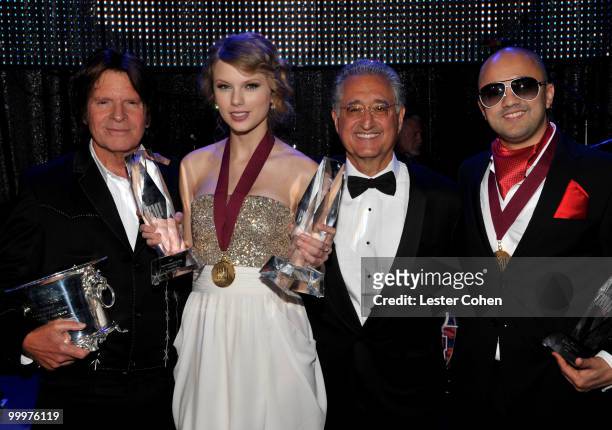 Musician John Fogerty, musician Taylor Swift, BMI President and CEO Del Bryant and producer/songwriter RedOne pose during the 58th Annual BMI Pop...
