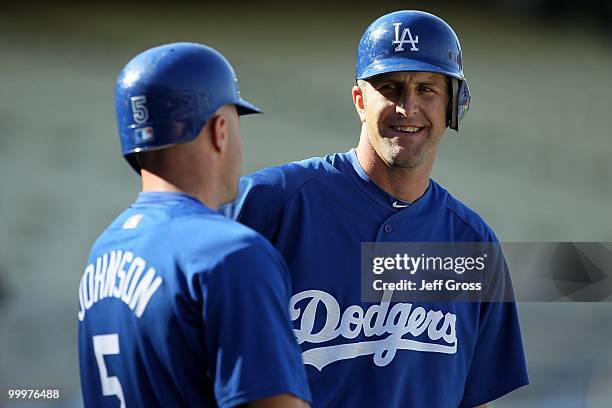 Casey Blake and Reed Johnson of the Los Angeles Dodgers talk during batting practice prior to the start of the game against the Milwaukee Brewers at...