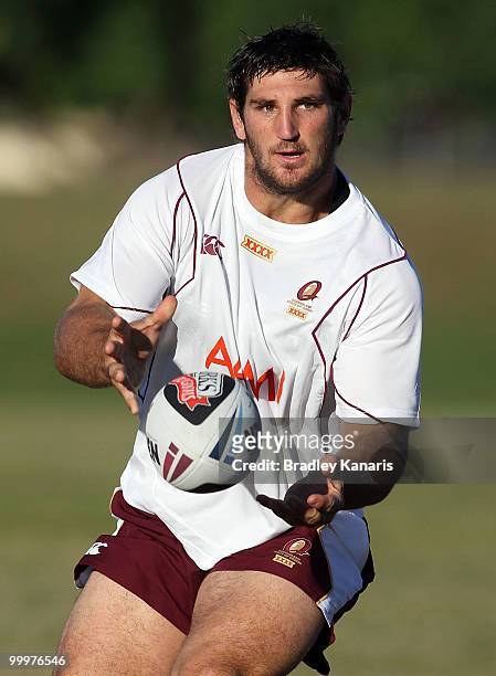 David Taylor passes the ball at the Queensland Maroons State of Origin team fans day and training session held at Stockland Park on May 19, 2010 at...