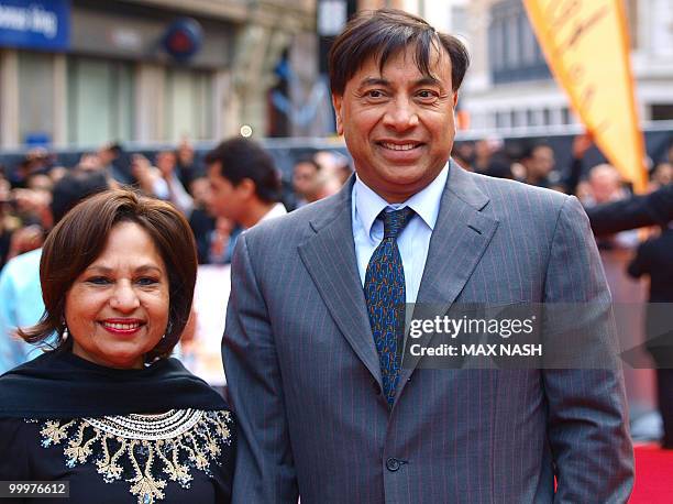 Indian steel magnate and billionaire Lakshmi Mittal poses with his wife Usha as he arrives at the European Premiere of the film 'Kites' directed by...