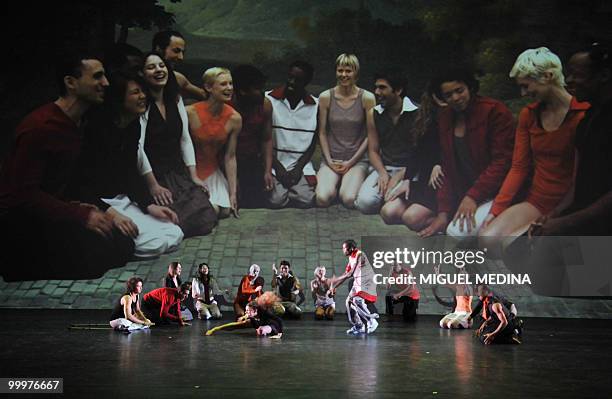 Dancers perform in front of a giant screen featuring themselves during during their first performance before an audience of the Orphee opera,...