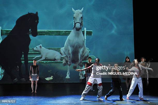 Dancers perform in front of a giant screen featuring horses during their first performance before an audience of the Orphee operaof the Orphee opera,...