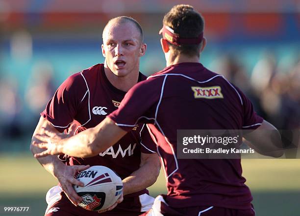 Darren Lockyer looks to take on the defence at the Queensland Maroons State of Origin team fans day and training session held at Stockland Park on...