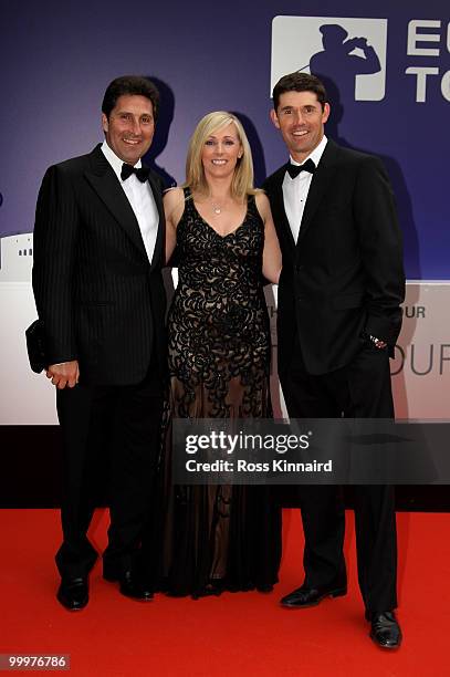 Padraig Harrington and wife Caroline pose with Jose-Maria Olazabal at the 2010 Tour Dinner prior to the BMW PGA Championship on the West Course at...