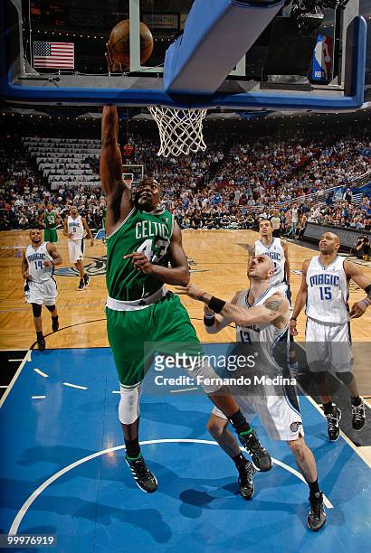 Kendrick Perkins of the Boston Celtics shoots a layup against Marcin Gortat of the Orlando Magic in Game Two of the Eastern Conference Finals during...