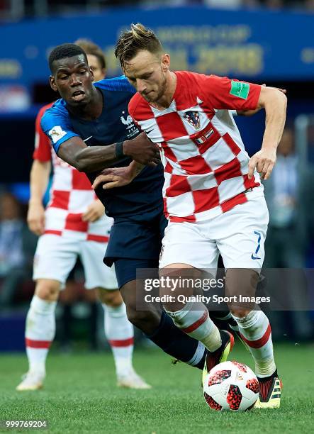 Paul Pogba of France competes for the ball with Ivan Rakitic of Croatia during the 2018 FIFA World Cup Russia Final between France and Croatia at...