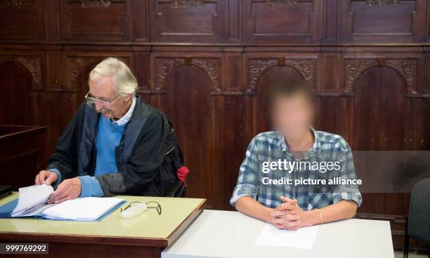 The defendant sits next to his lawyer Thomas Herzog in a court room of the district court Altona in Hamburg, Germany, 8 September 2017. The young man...