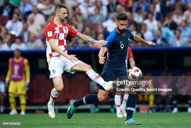 Olivier Giroud of France competes for the ball with Marcelo Brozovic of Croatia during the 2018 FIFA World Cup Russia Final between France and...