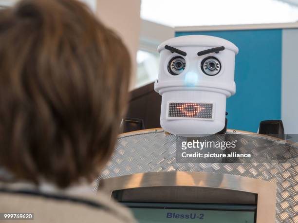 The robot BlessU-2 blesses 13-year-old Moritz in the Evangelical Academy in Frankfurt/Main, Germany, 08 September 2017. After his appearance at the...