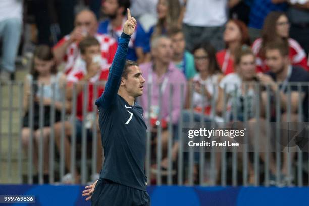 Antoine Griezmann of France celebrates after the final whistle by referee Nestor Pitana during the 2018 FIFA World Cup Russia Final between France...