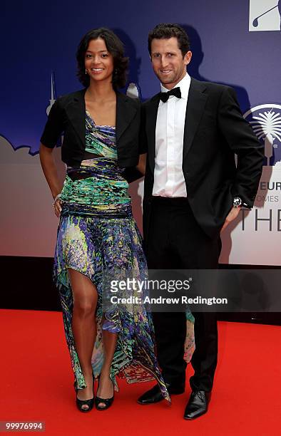 Gregory Bourdy of France arrives with girlfriend Annabelle Savignan at the 2010 Tour Dinner prior to the BMW PGA Championship on the West Course at...