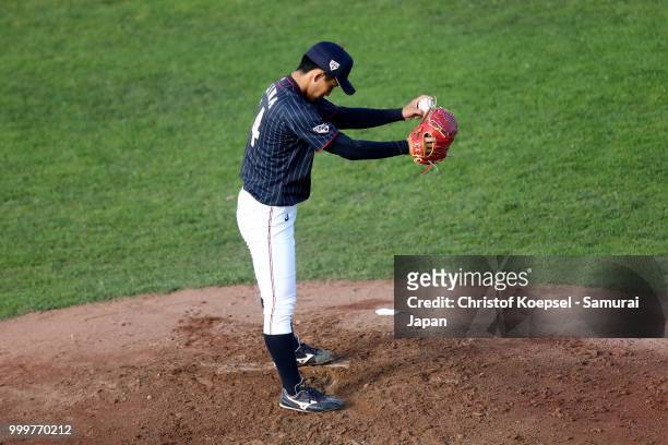Kazuya Ojima of Japan prepares to pitch in the first inning during the Haarlem Baseball Week game between Cuba and Japan at Pim Mulier Stadion on...