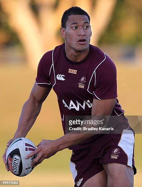Israel Folau looks to pass at the Queensland Maroons State of Origin team fans day and training session held at Stockland Park on May 19, 2010 at the...