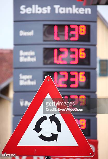 Roundabout sign and prices for petrol shown at a patrol station on May 06, 2010 in Bregenz, Austria. Bregenz is a big european city with more than...