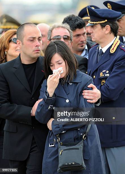 Relatives express their grief as the coffins are carried past of two Italian Alpine troops of the NATO-led International Security Assistance Force...