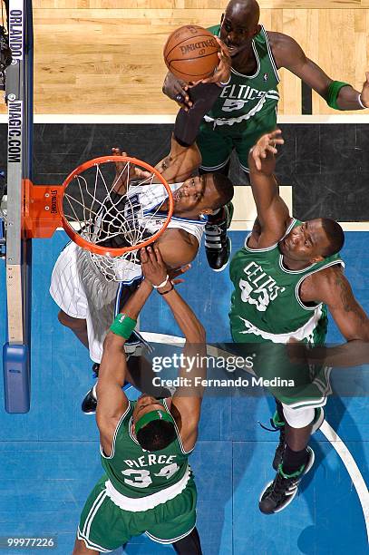 Kevin Garnett, Kendrick Perkins and Paul Pierce of the Boston Celtics defend against Dwight Howard of the Orlando Magic in Game Two of the Eastern...