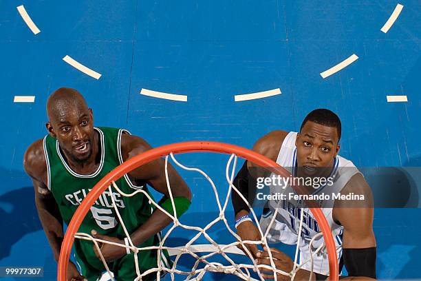 Kevin Garnett of the Boston Celtics and Dwight Howard of the Orlando Magic anticipate a rebound in Game Two of the Eastern Conference Finals during...