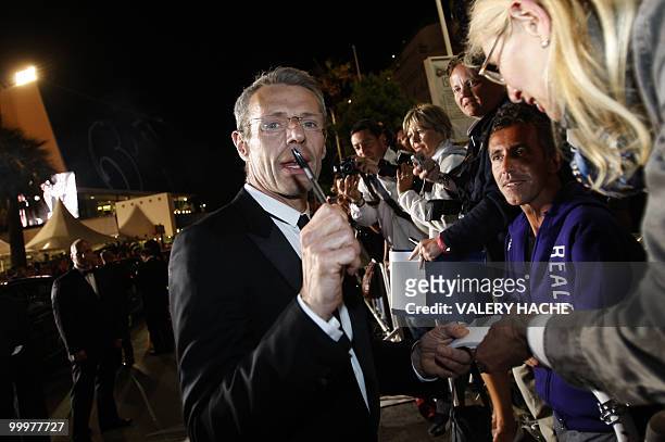 French actor Lambert Wilson signs autographs after the screening of "Des Hommes et des Dieux" presented in competition at the 63rd Cannes Film...