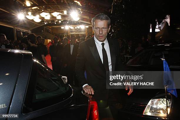 French actor Lambert Wilson leaves after the screening of "Des Hommes et des Dieux" presented in competition at the 63rd Cannes Film Festival on May...