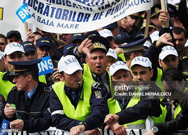 Romanian Trade Union members shout anti-governmental slogans and blow whistles during a mass protest in the front of the Romanian Government...