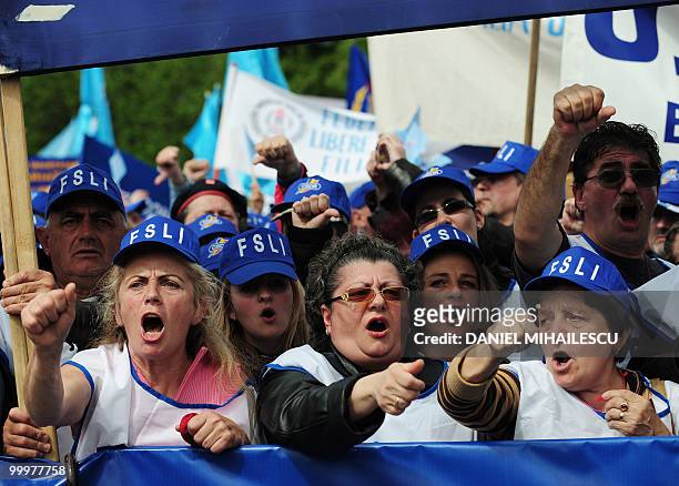 Romanian Trade Union members shout anti-governmental slogans during a mass protest in the front of the Romanian Government headquarters in Bucharest...