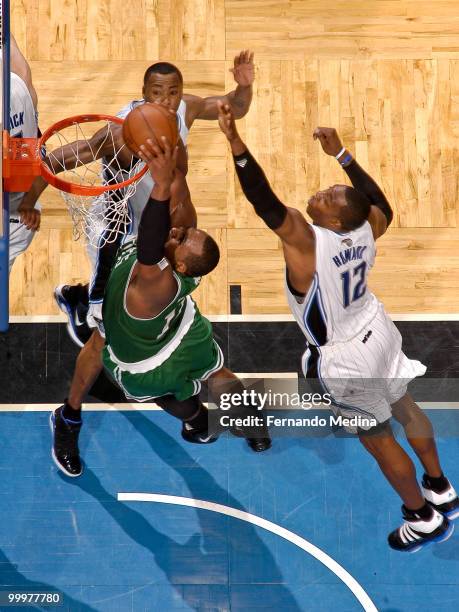 Glen Davis of the Boston Celtics dunks against Dwight Howard and Rashard Lewis of the Orlando Magic in Game Two of the Eastern Conference Finals...