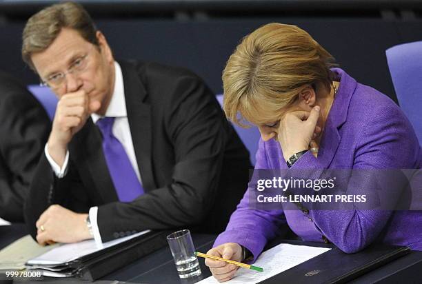 German Chancellor Angela Merkel and Foreign Minister Guido Westerwelle take part in a session at the Bundestag on May 19, 2010 in Berlin. Merkel...