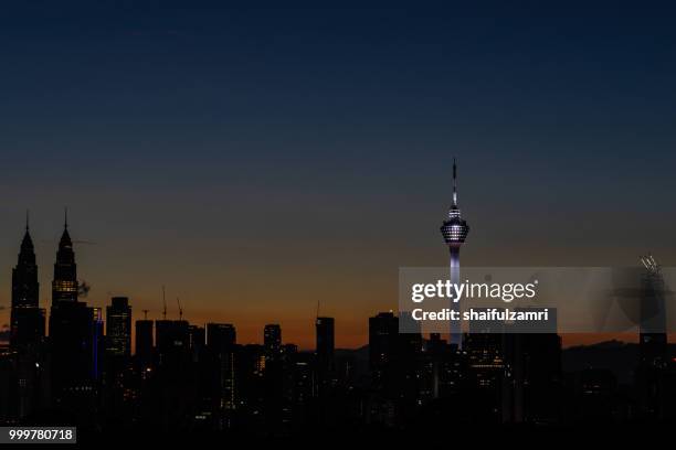 majestic sunrise over kl tower and surrounded buildings in downtown kuala lumpur, malaysia. - shaifulzamri fotografías e imágenes de stock