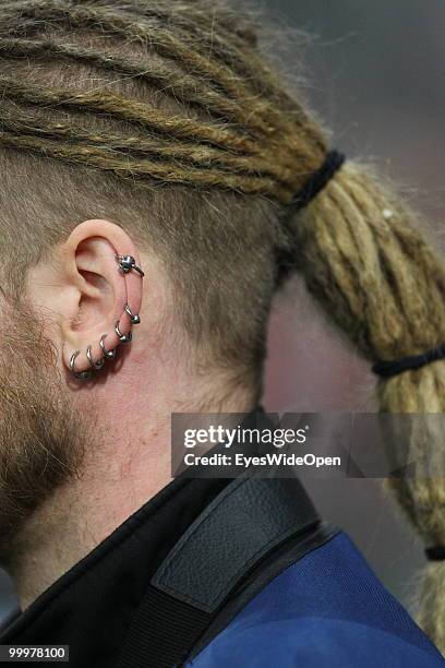 Young man with rastafarian hair styling and ear piercings. On May 09, 2010 in Munich, Germany.