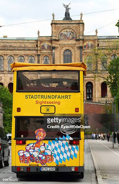 Sightseeing bus with tourists on a trip in front of the Maximilianeum. On May 09, 2010 in Munich, Germany.