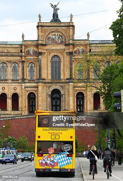 Sightseeing bus with tourists on a trip in front of the Maximilianeum. On May 09, 2010 in Munich, Germany.