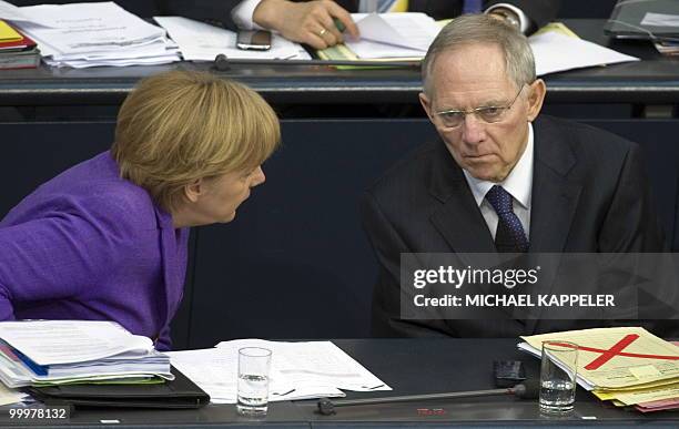 German Chancellor Angela Merkel speaks with Finance Minister Wolfgang Schaeuble at the Bundestag on May 19, 2010 in Berlin. Merkel called for a...