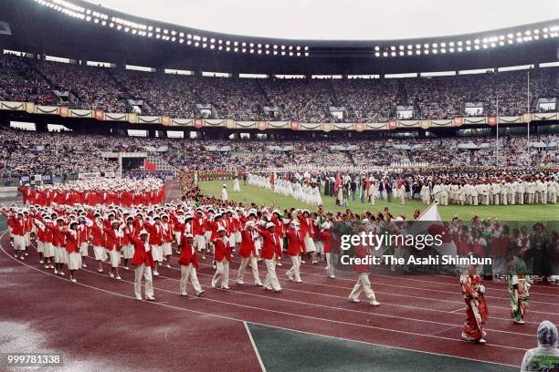 Japanese delegation walk into the stadium during the opening ceremony of the 10th Asian Games at the Jamsil Stadiumon September 20, 1986 in Seoul,...