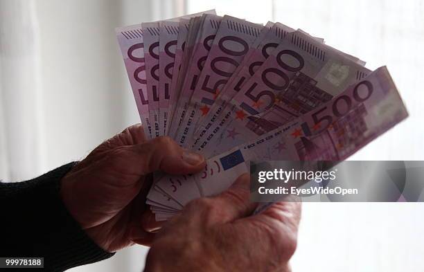 Businessman with 500 Euro banknotes. On May 09, 2010 in Munich, Germany.