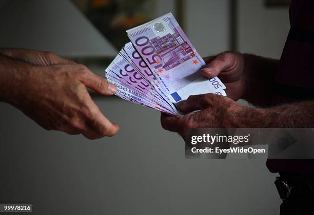 Businessman with 500 Euro banknotes. On May 09, 2010 in Munich, Germany.