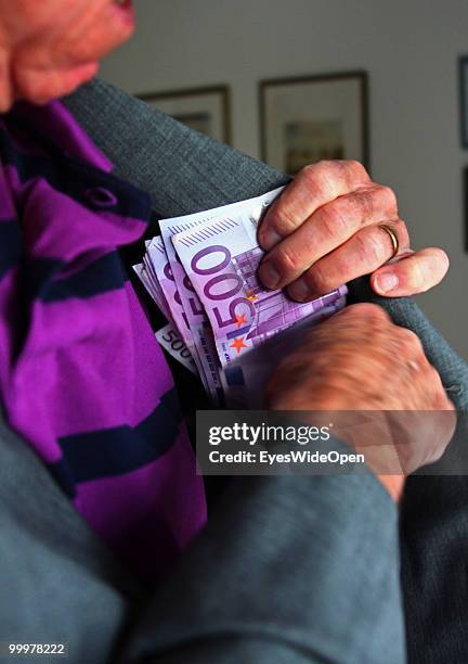 Businessman with 500 Euro banknotes. On May 09, 2010 in Munich, Germany.