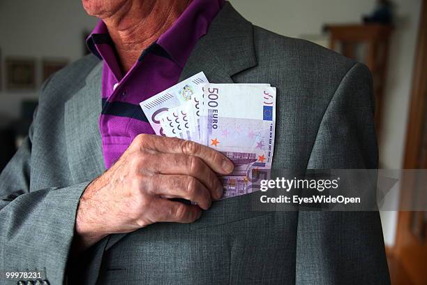 Businessman with 500 Euro banknotes. On May 09, 2010 in Munich, Germany.