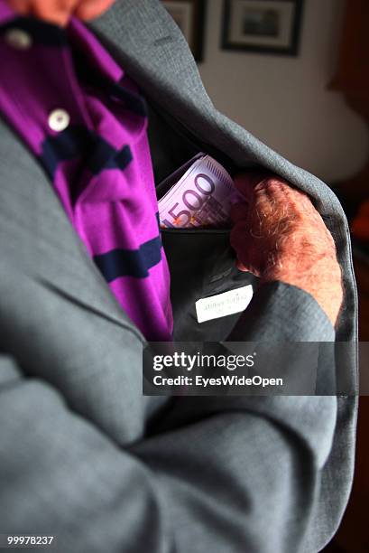 Businessman with 500 Euro banknotes. On May 09, 2010 in Munich, Germany.