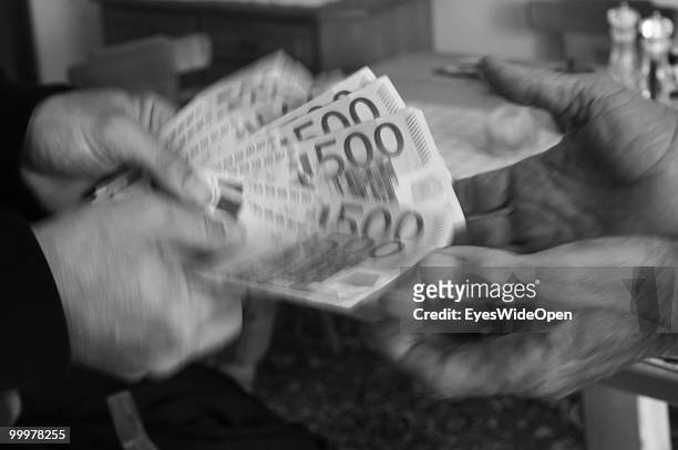 Businessman with 500 Euro banknotes. On May 09, 2010 in Munich, Germany.