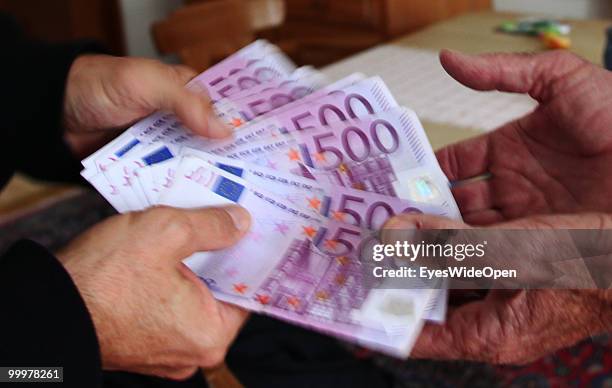 Businessman with 500 Euro banknotes. On May 09, 2010 in Munich, Germany.