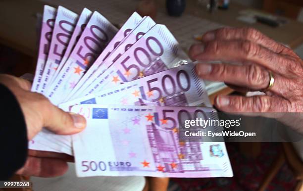 Businessman with 500 Euro banknotes. On May 09, 2010 in Munich, Germany.