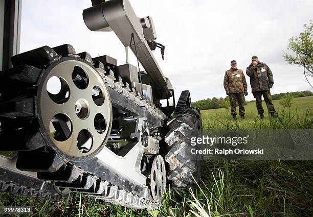 Land-robot stands next to soldiers at the German army base on May 18, 2010 in Hammelburg, Germany. ELROB provides an overview of the current state of...